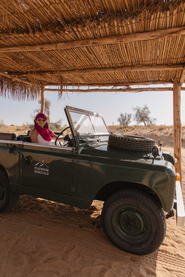 Jeep navigating through sandy desert dunes at Platinum Heritage Desert Camp.