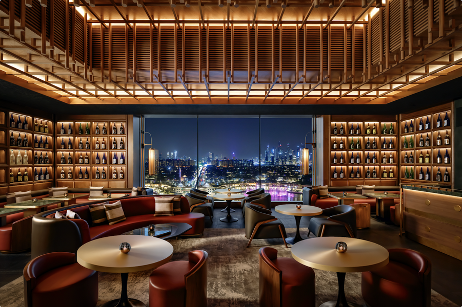 Stylish bar area at Nobu Dubai with a variety of drinks and elegant interior.