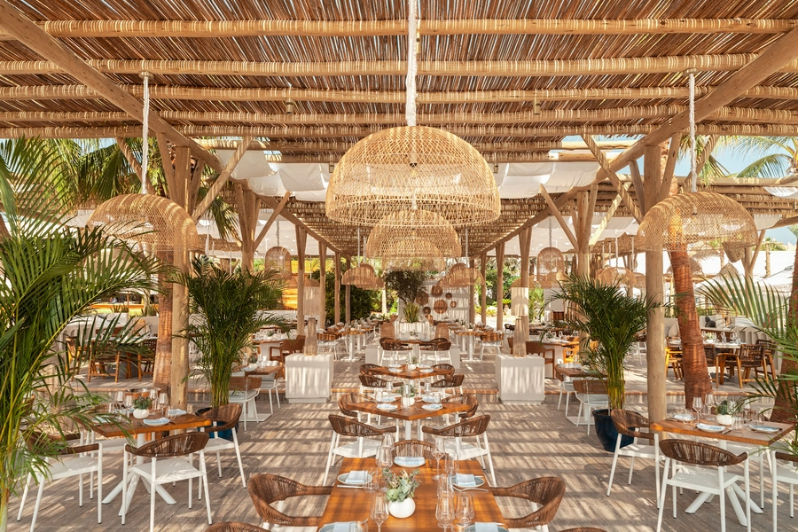 Visitors enjoying a relaxing day at White Beach with swimwear and water activities.