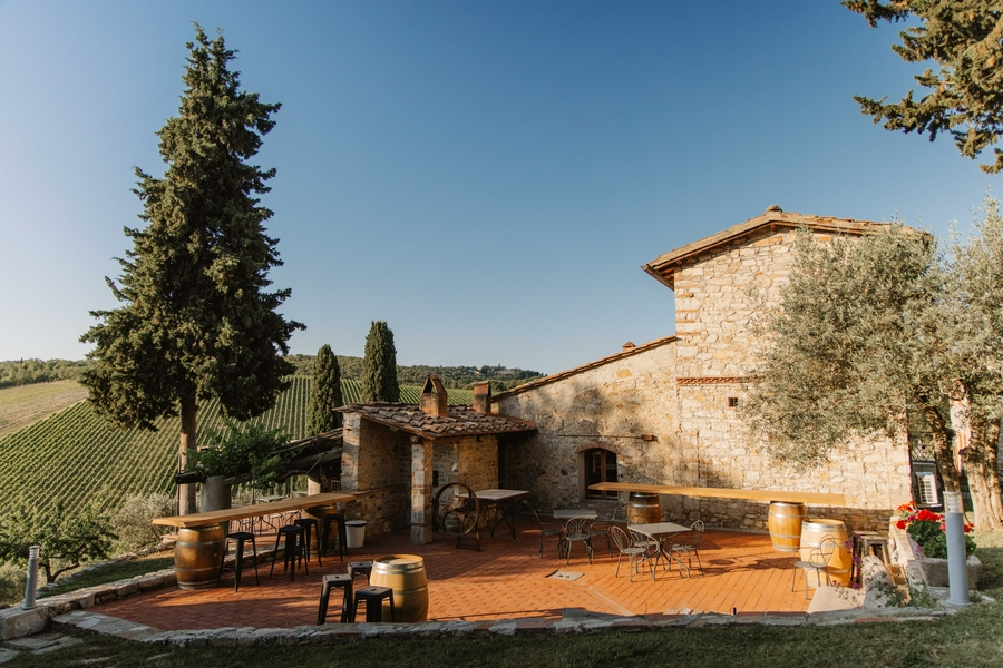 Querceto di Castellina showcasing Tuscany's vineyards and rolling hills.
