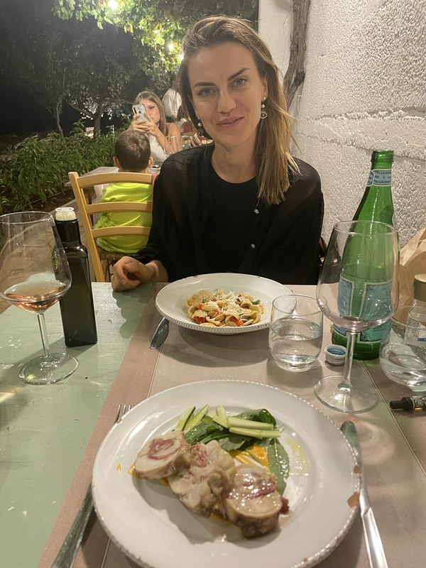 Couples enjoying a romantic dinner in a picturesque garden setting.