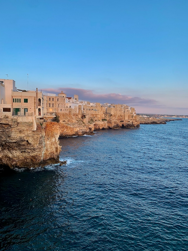 Scenic view of the Lungomare di Polignano a Mare, showcasing cliffs and the Mediterranean Sea.