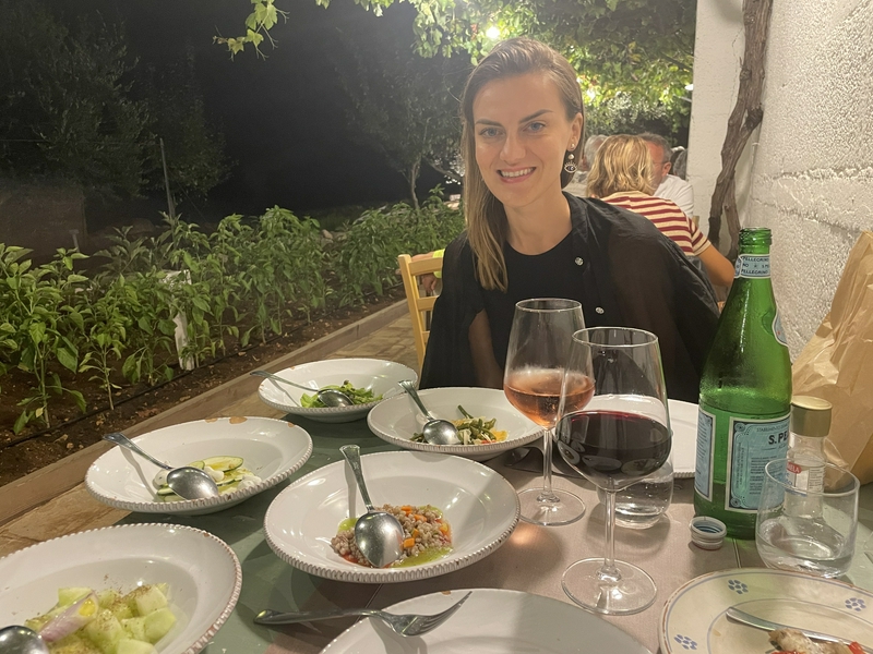 Couples enjoying an intimate dining experience in a rustic garden setting.