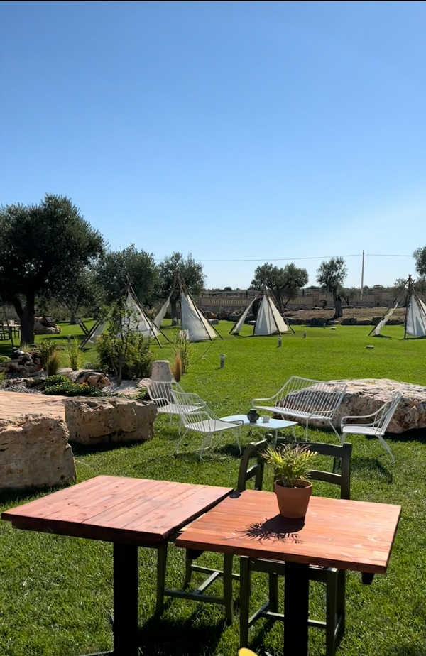 Relaxing outdoor experience at a tranquil masseria surrounded by nature.