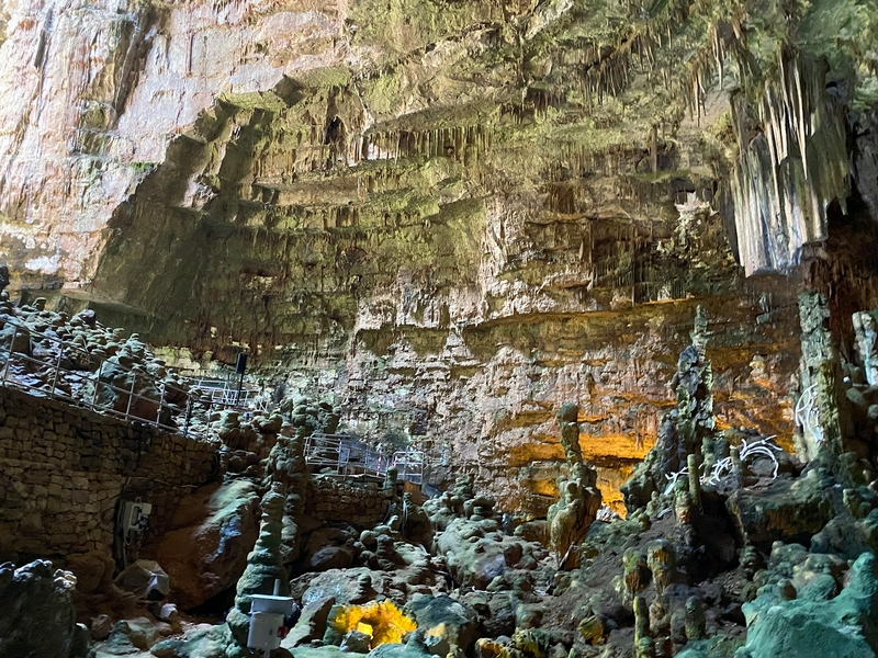 Cave exploration in the Grotte di Castellana with stunning limestone formations.