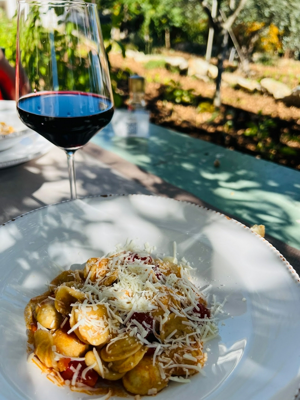 Couples enjoying a romantic dinner in a beautiful garden setting.