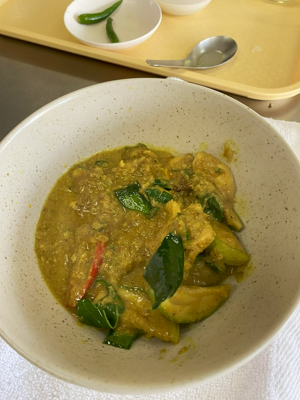 Participants enjoying a hands-on Thai cooking class with local chef.