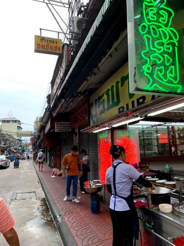 Bangkok Chinatown bustling with street food vendors and visitors.