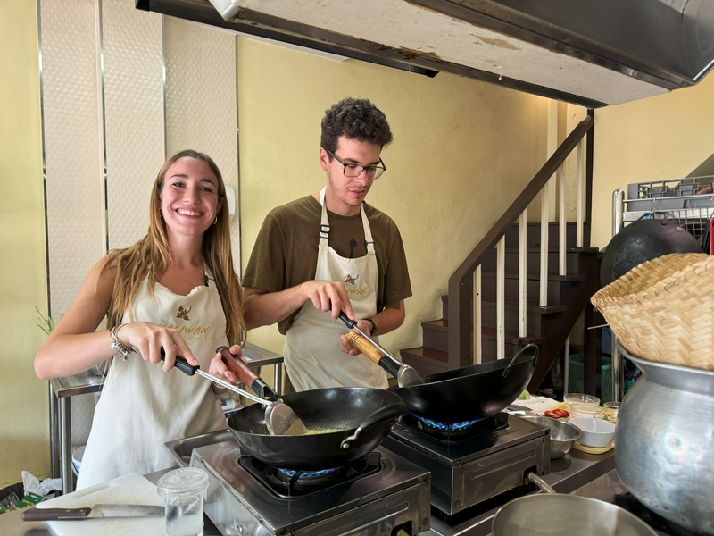 Participants enjoying an intimate outdoor cooking class with local ingredients.