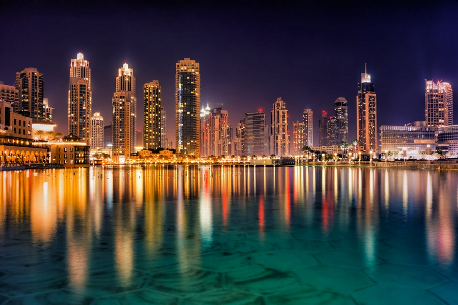 Walking along Dubai Marina, showcasing modern architecture and lively atmosphere.