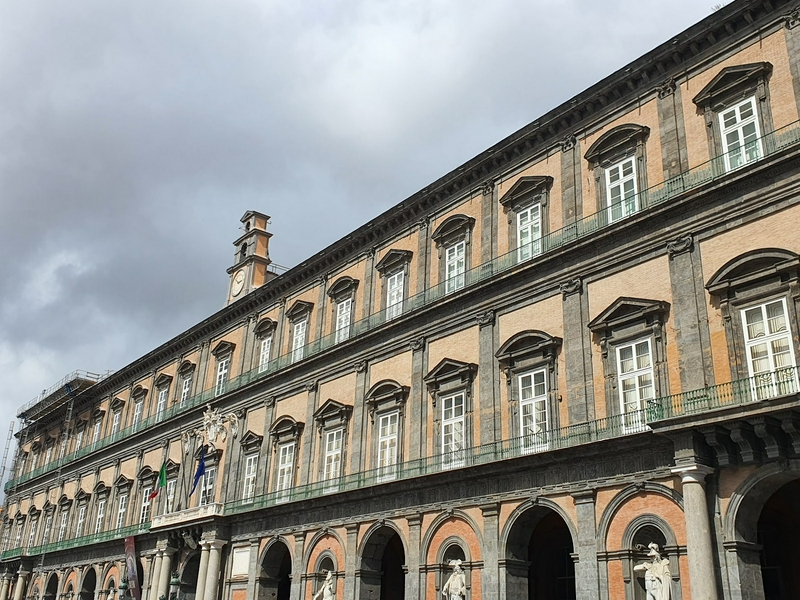 Participants blindfolded walking at Piazza del Plebiscito in Naples.