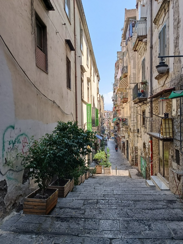 Participants exploring colorful urban murals in Vico Totò.