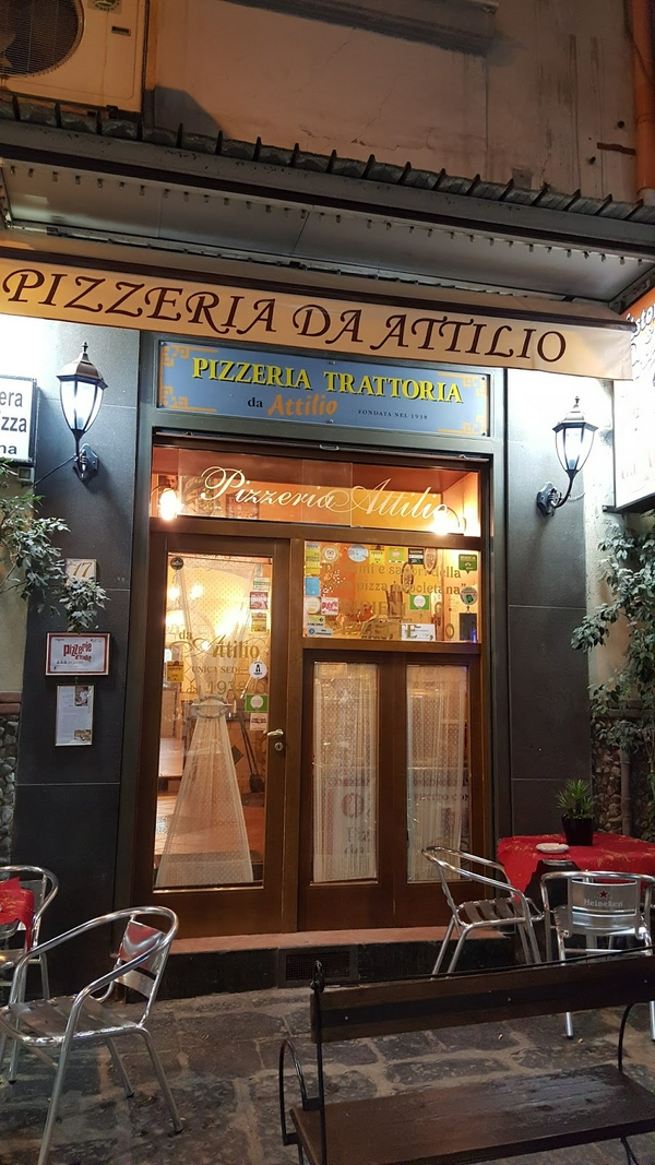 Delicious pizza served at Pizzeria Da Attilio in Naples, Italy.