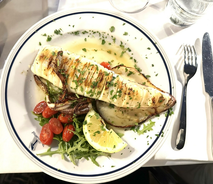 Dining area with scenic views at Transatlantico Ristorante Suite, featuring seafood specialties.
