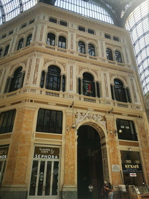 Galleria Umberto I, a historic shopping gallery in Naples, Italy, featuring neoclassical architecture and a grand glass dome.