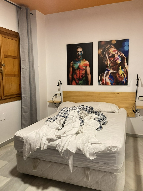 Clean and comfortable room at Arc House Plaza with modern amenities.