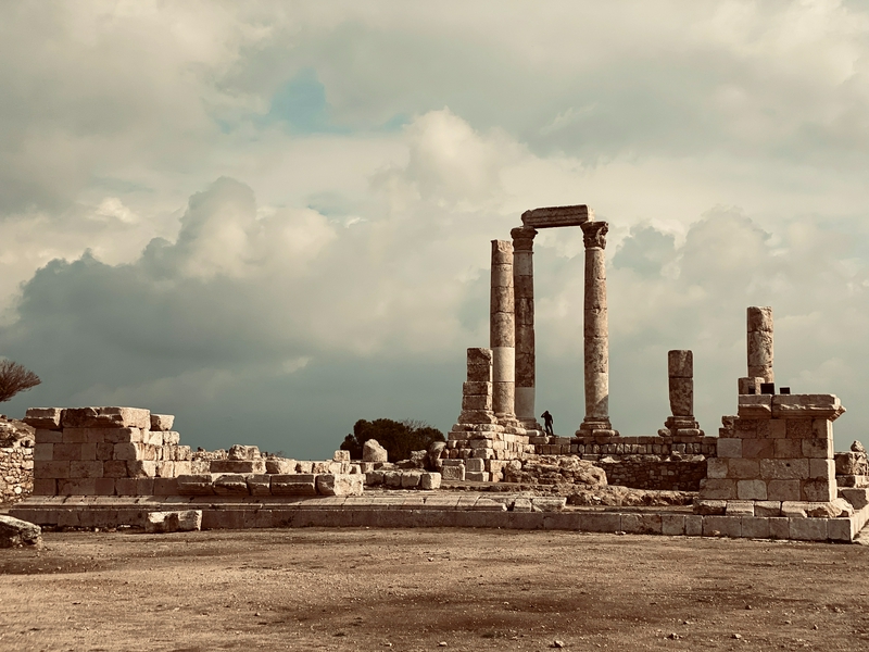 Ancient stone ruins with columns, representing historical architecture.