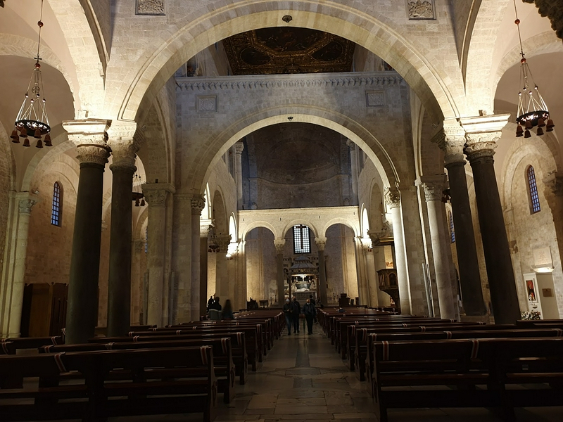Interior view of the Basilica of Saint Nicholas featuring intricate architecture and beautiful artworks.