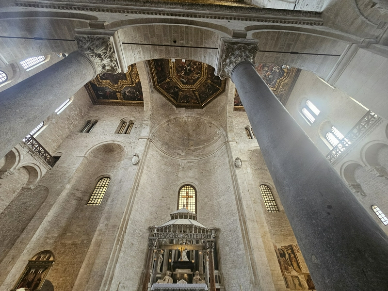 Interior view of Basilica of Saint Nicholas showcasing columns and arches.