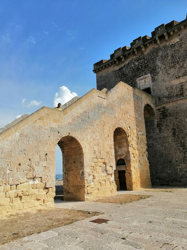 Enjoying a relaxing day at Torre Lapillo Beach with clear waters and sandy shores.