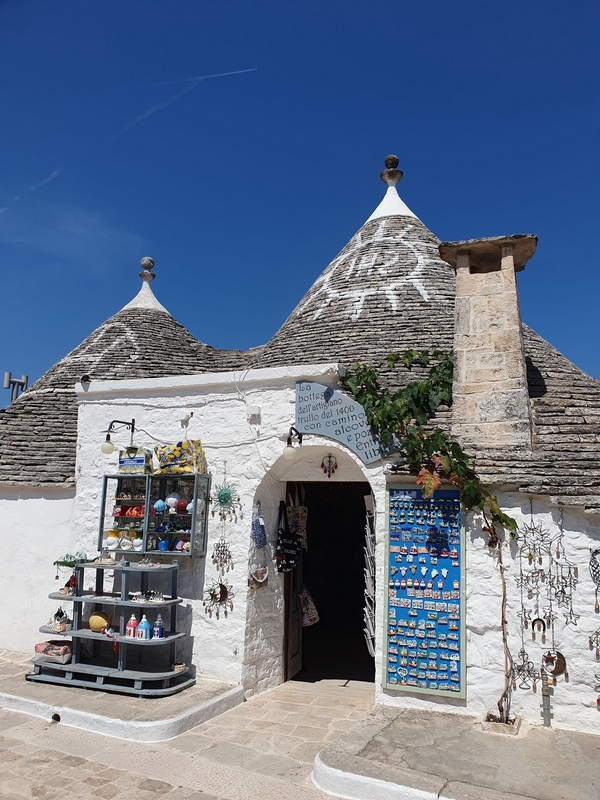 Traditional trulli houses in Alberobello made of white limestone.