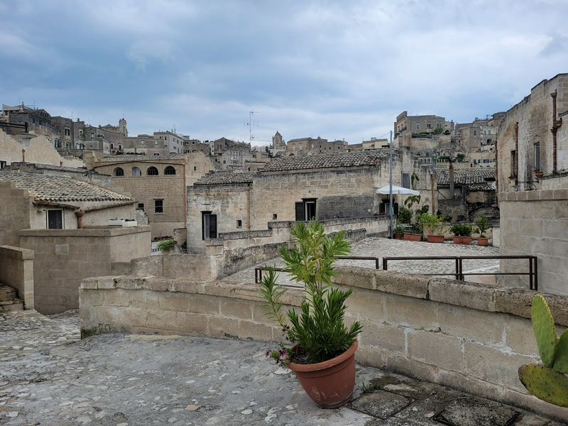 Unique architecture of Matera showcasing cave dwellings and urban landscapes.