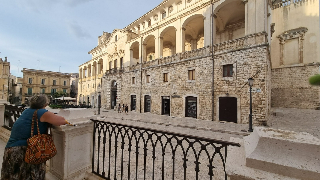 Group exploring a small city in Puglia with a casual vibe.