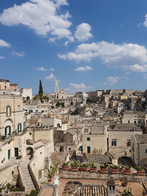 Historic view of Matera showcasing its ancient architecture and stunning landscapes.