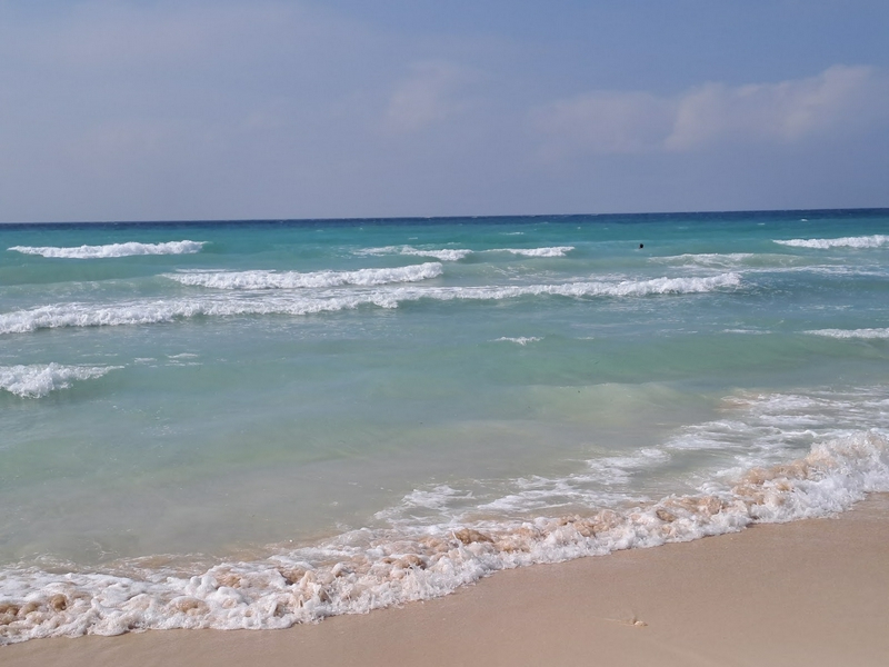 Golden sands and clear waters of Torre Lapillo Beach
