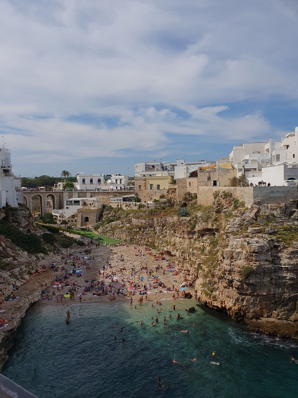 Scenic views of Polignano a Mare showcasing its coastal cliffs and tourist attractions.