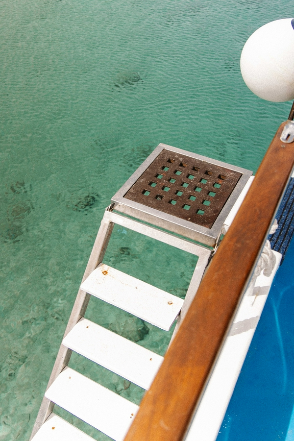 Poseidon boat tour showcasing water, a boat, and swimming activities.