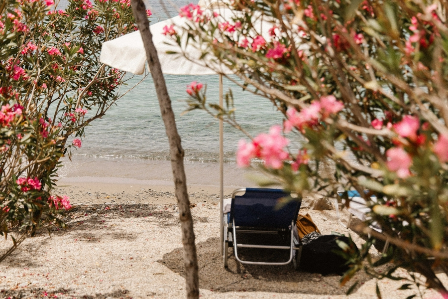 Serene Toli Beach on Symi Island, Greece, ideal for relaxation and swimming.