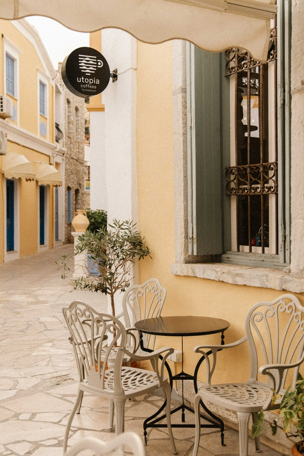 Outdoor cafe setting with tables and chairs for dining.